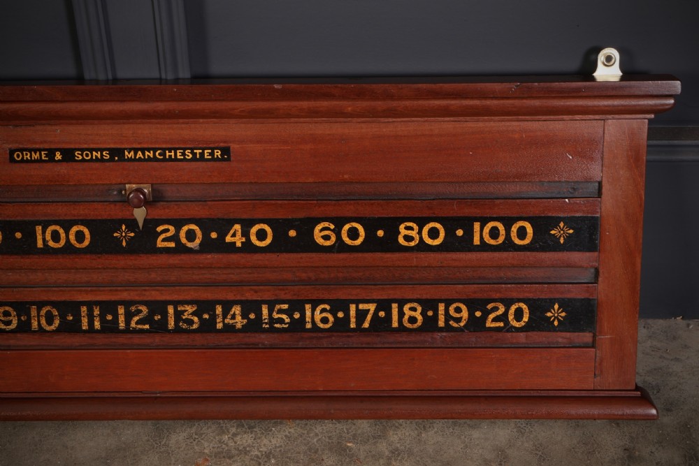 A wall-mounted Victorian mahogany snooker scoreboard featuring brass sliding pointers and gilded numerals set against black painted tracks. View III