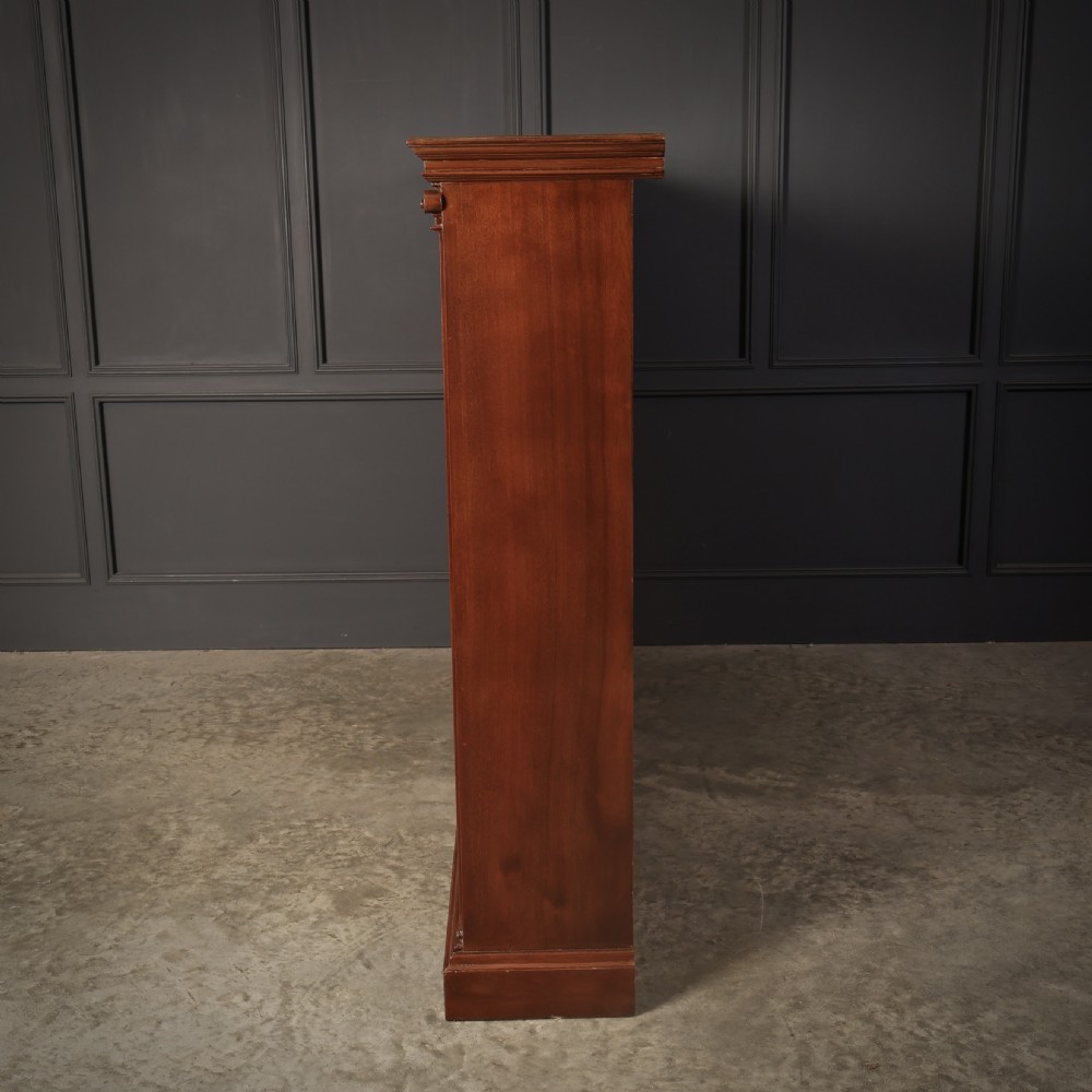 A large Victorian open oak bookcase featuring two wide bays with adjustable shelves, fluted pilasters, and a solid plinth base. View IX