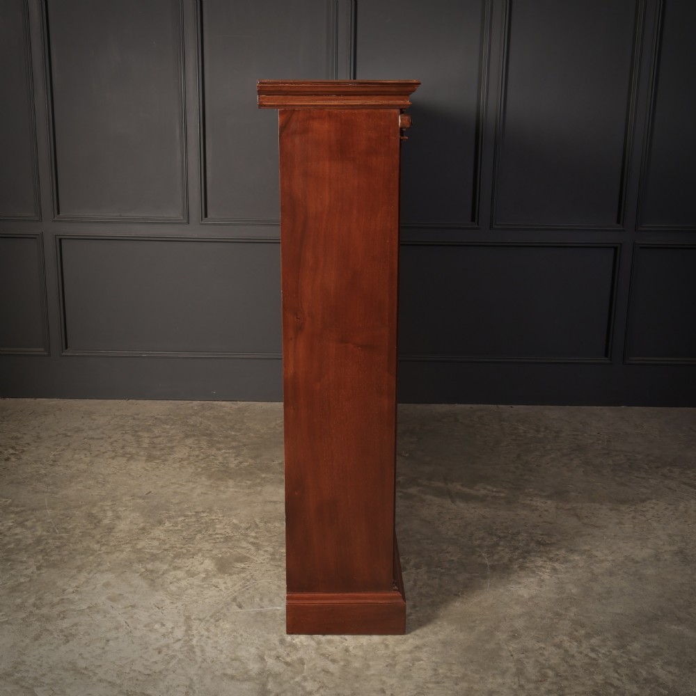 A large Victorian open oak bookcase featuring two wide bays with adjustable shelves, fluted pilasters, and a solid plinth base. View XI