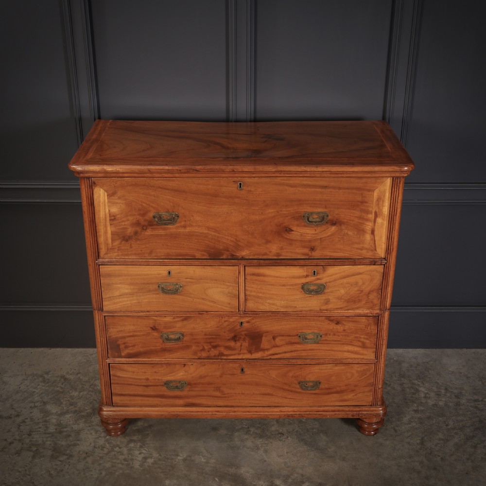 A Victorian camphor wood military campaign secretaire chest featuring brass flush recessed handles and turned feet. View V