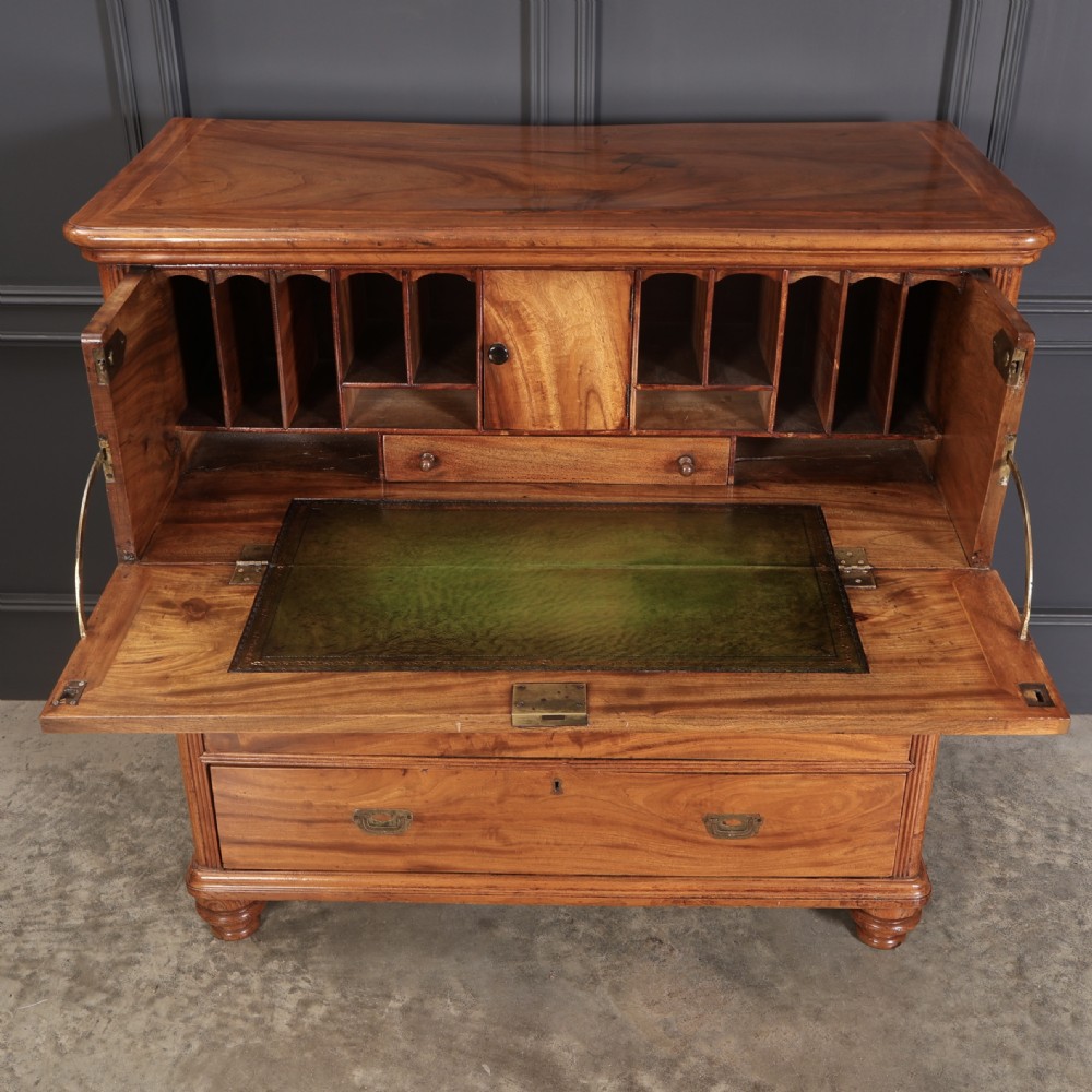 A Victorian camphor wood military campaign secretaire chest featuring brass flush recessed handles and turned feet. View VIII
