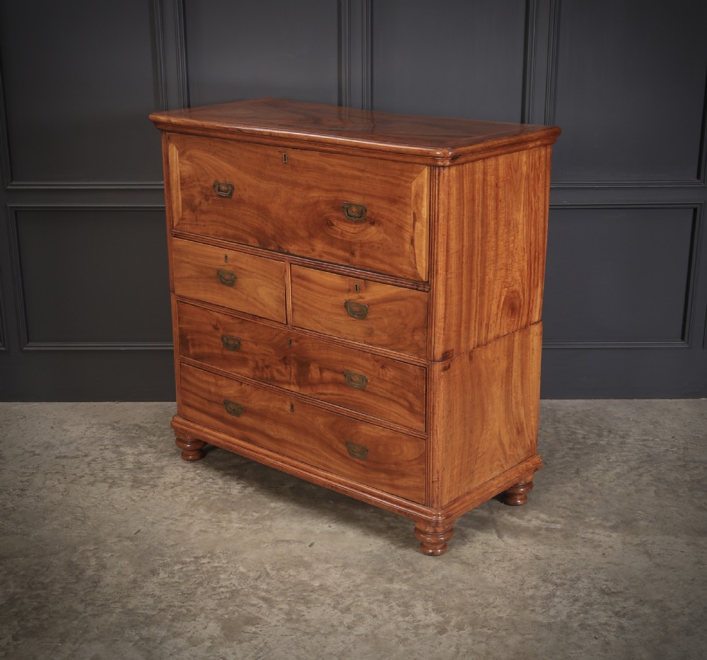 A Victorian camphor wood military campaign secretaire chest featuring brass flush recessed handles and turned feet. View IX