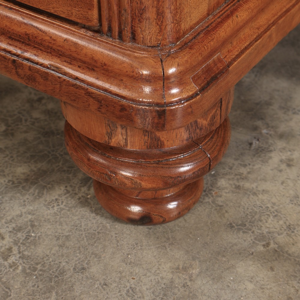 A Victorian camphor wood military campaign secretaire chest featuring brass flush recessed handles and turned feet. View XII