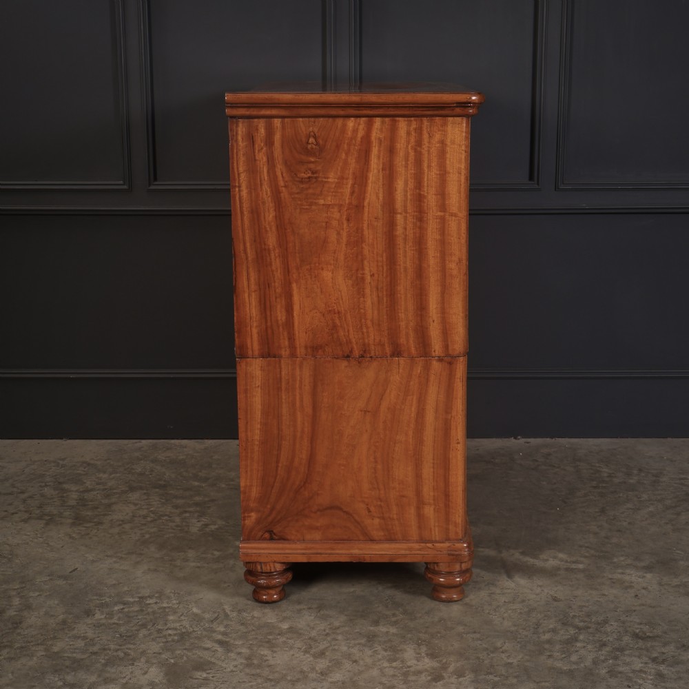 A Victorian camphor wood military campaign secretaire chest featuring brass flush recessed handles and turned feet. View XV