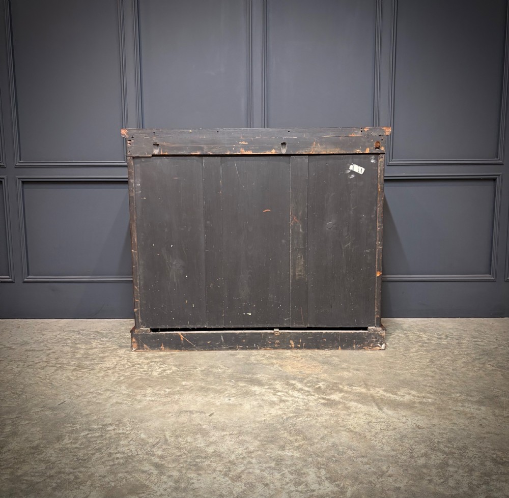 A William IV rosewood side cabinet with twin arch-topped mirrored doors, carved foliage details along the frieze, and a sturdy plinth base. View X