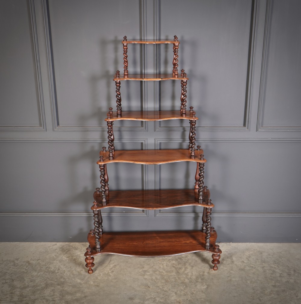 A Victorian rosewood six-tier whatnot stand featuring graduated open shelves supported by barley twist columns and topped with turned finials. View III
