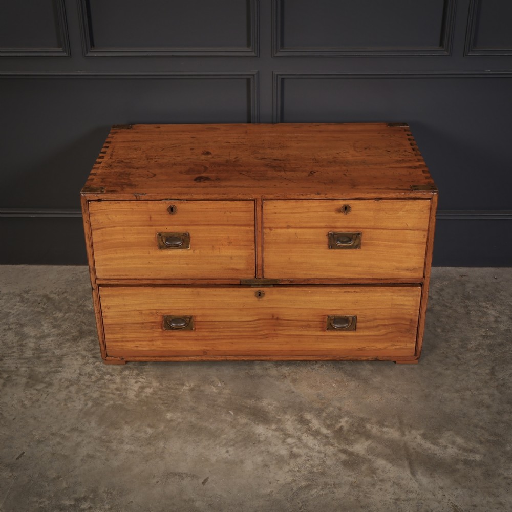 A low camphor wood campaign chest featuring recessed brass handles, brass corner brackets, exposed dovetail joints, and side brass carrying handles. View VII