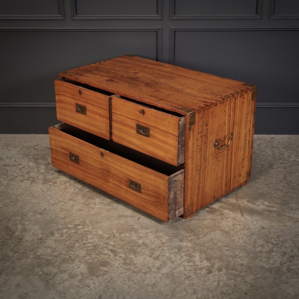 A low camphor wood campaign chest featuring recessed brass handles, brass corner brackets, exposed dovetail joints, and side brass carrying handles. View VIII