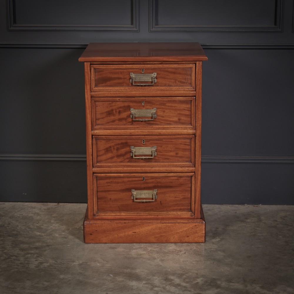 A pair of Victorian mahogany bedside chests with four graduated drawers each, brass index pull handles, and plinth bases. View III