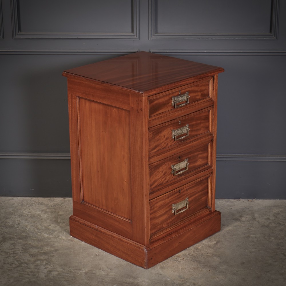 A pair of Victorian mahogany bedside chests with four graduated drawers each, brass index pull handles, and plinth bases. View V