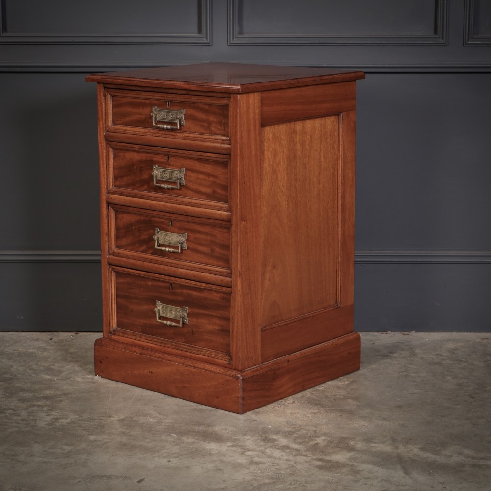A pair of Victorian mahogany bedside chests with four graduated drawers each, brass index pull handles, and plinth bases. View IX