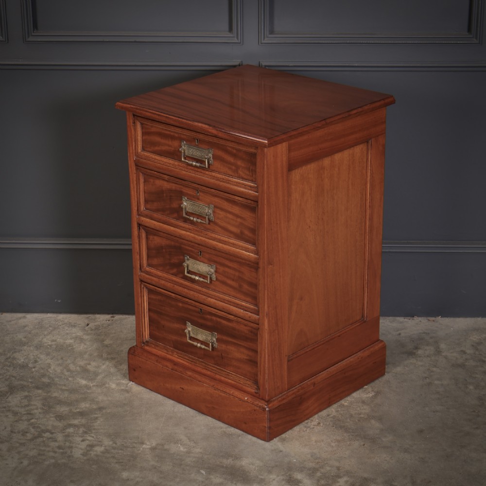 A pair of Victorian mahogany bedside chests with four graduated drawers each, brass index pull handles, and plinth bases. View X