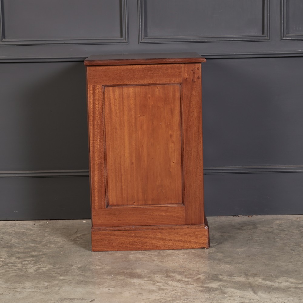A pair of Victorian mahogany bedside chests with four graduated drawers each, brass index pull handles, and plinth bases. View XIV
