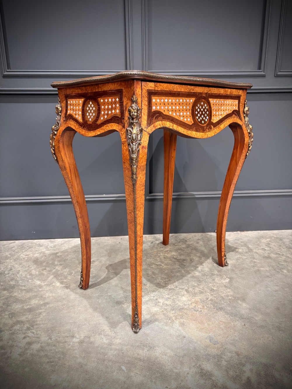 French style side table featuring geometric lattice marquetry inlay, cabriole legs, and gilded bronze ormolu mounts. View III
