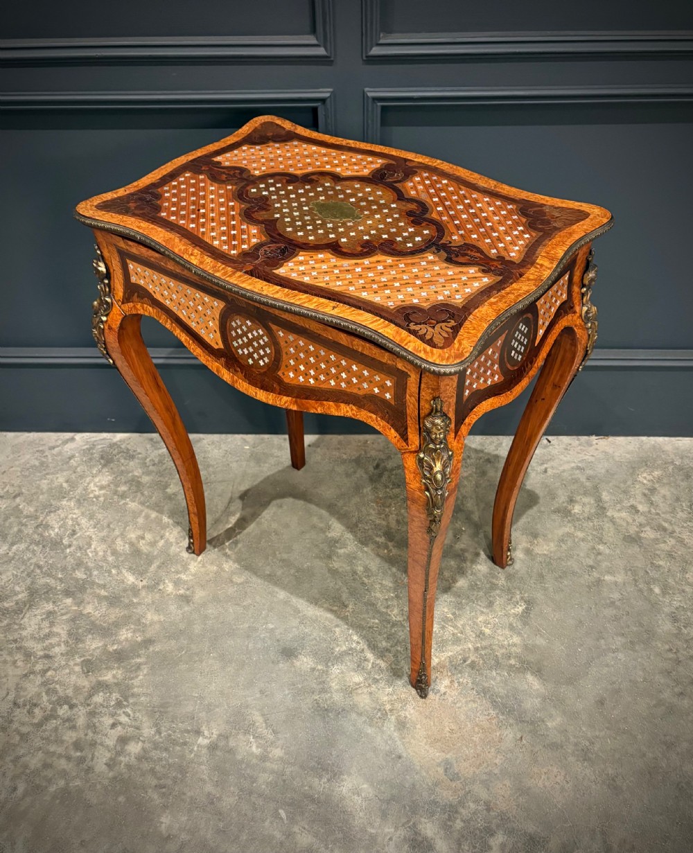 French style side table featuring geometric lattice marquetry inlay, cabriole legs, and gilded bronze ormolu mounts. View VIII