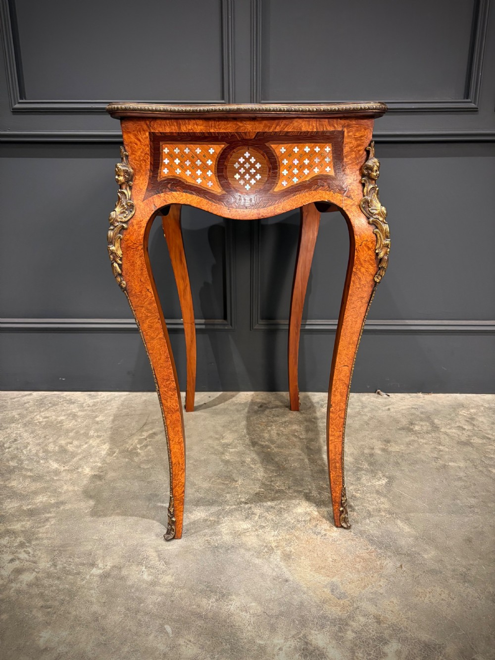French style side table featuring geometric lattice marquetry inlay, cabriole legs, and gilded bronze ormolu mounts. View XII