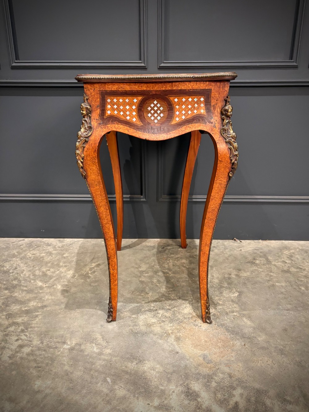 French style side table featuring geometric lattice marquetry inlay, cabriole legs, and gilded bronze ormolu mounts. View XIV