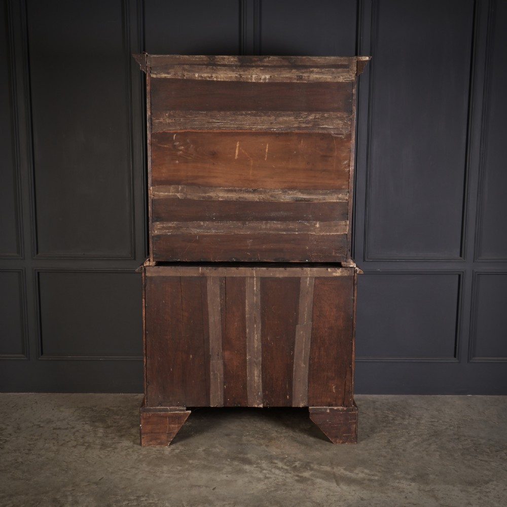 A two-part Queen Anne walnut cabinet on chest featuring upper cupboard doors with bookmatched timber grain and a lower chest with four drawers on bracket feet. View XIII