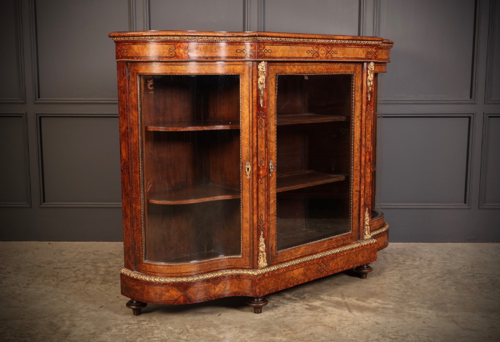 A Victorian burr walnut credenza with intricate marquetry inlay, gilt bronze mounts, and glazed display sections. View II