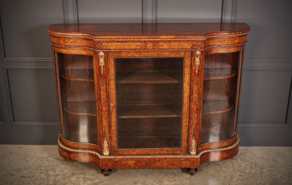 A Victorian burr walnut credenza with intricate marquetry inlay, gilt bronze mounts, and glazed display sections. View III