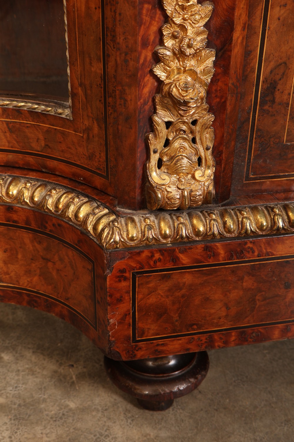 A Victorian burr walnut credenza with intricate marquetry inlay, gilt bronze mounts, and glazed display sections. View X