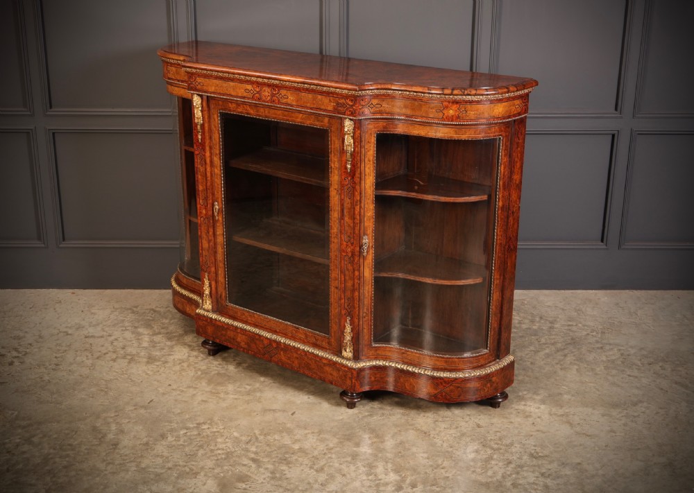 A Victorian burr walnut credenza with intricate marquetry inlay, gilt bronze mounts, and glazed display sections. View XIII