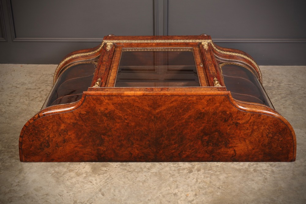 A Victorian burr walnut credenza with intricate marquetry inlay, gilt bronze mounts, and glazed display sections. View XVII