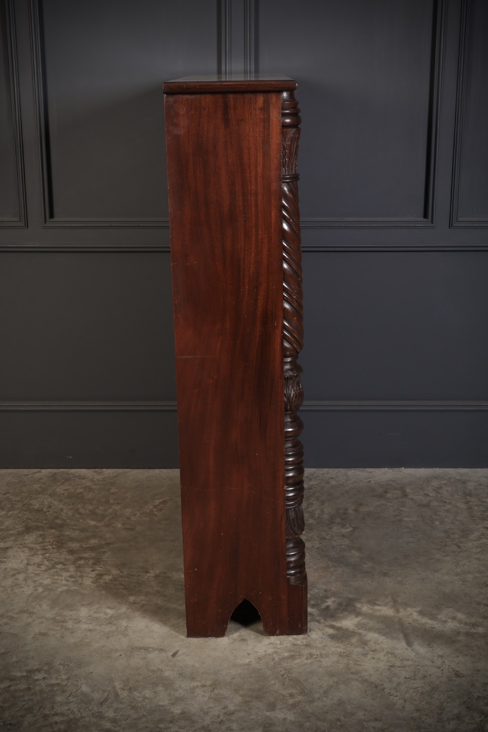 A William IV dark mahogany open bookcase featuring four shelves flanked by spiral twist carved columns and a detailed frieze. View IX