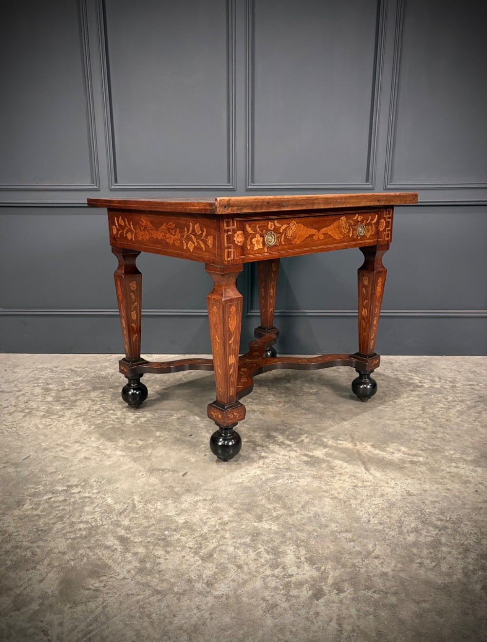 An eighteenth-century Dutch marquetry architects table featuring an adjustable tilted top decorated with floral wood inlays and resting on shaped legs with bun feet. View II