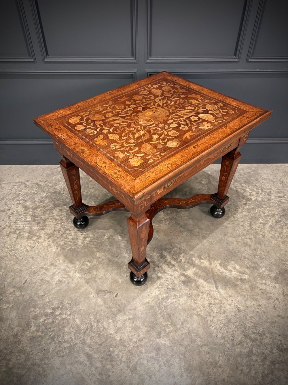 An eighteenth-century Dutch marquetry architects table featuring an adjustable tilted top decorated with floral wood inlays and resting on shaped legs with bun feet. View III
