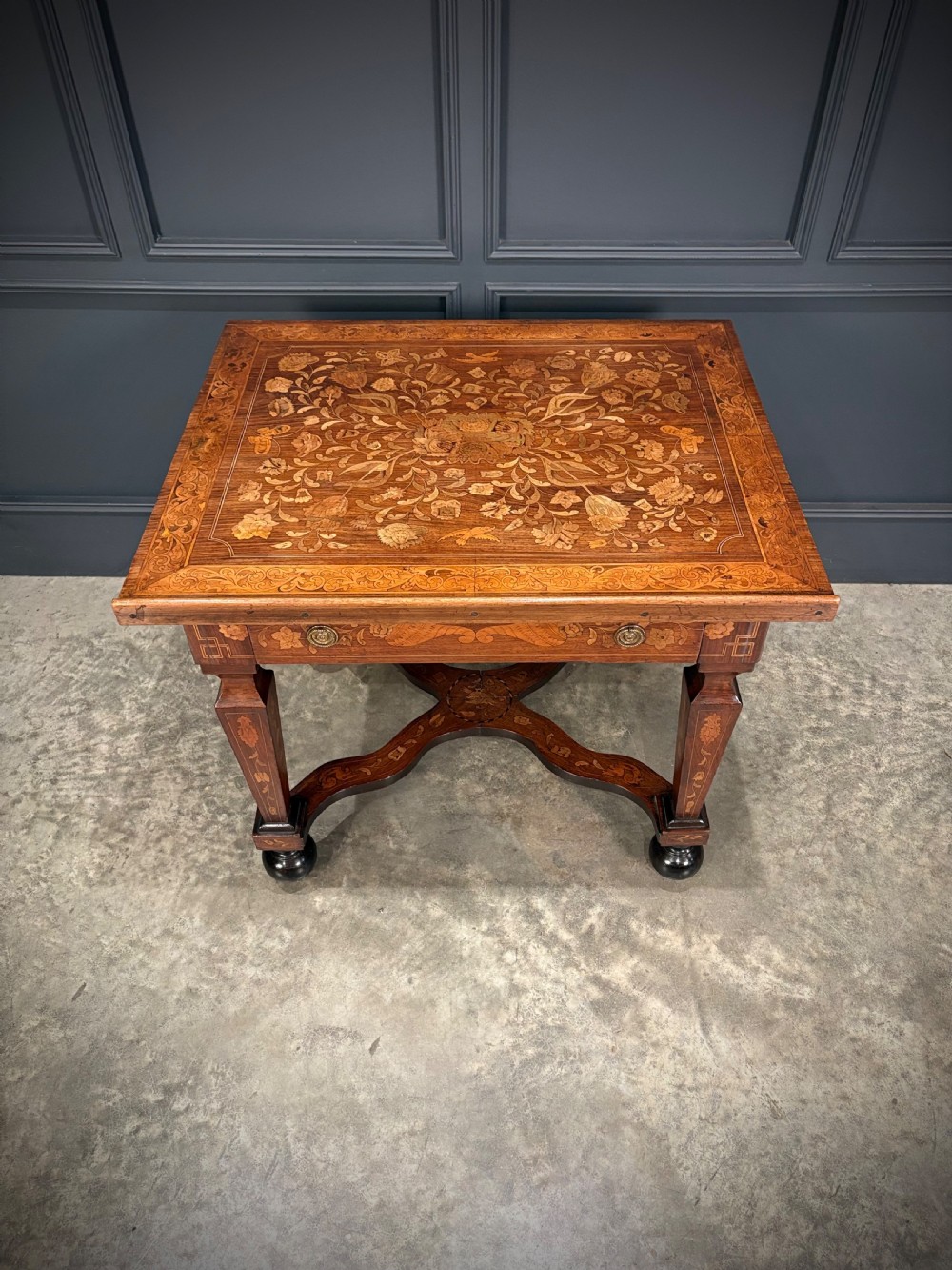 An eighteenth-century Dutch marquetry architects table featuring an adjustable tilted top decorated with floral wood inlays and resting on shaped legs with bun feet. View IV