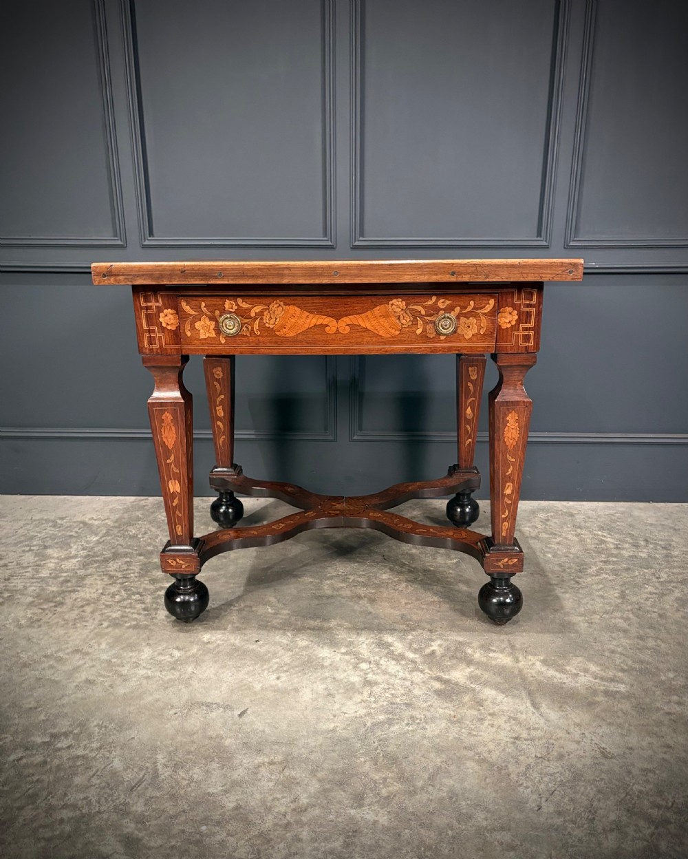 An eighteenth-century Dutch marquetry architects table featuring an adjustable tilted top decorated with floral wood inlays and resting on shaped legs with bun feet. View V