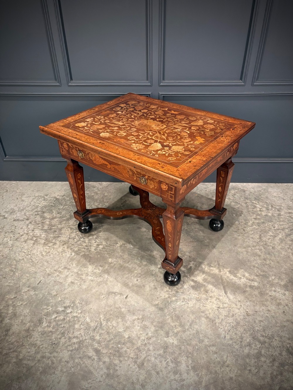 An eighteenth-century Dutch marquetry architects table featuring an adjustable tilted top decorated with floral wood inlays and resting on shaped legs with bun feet. View VI