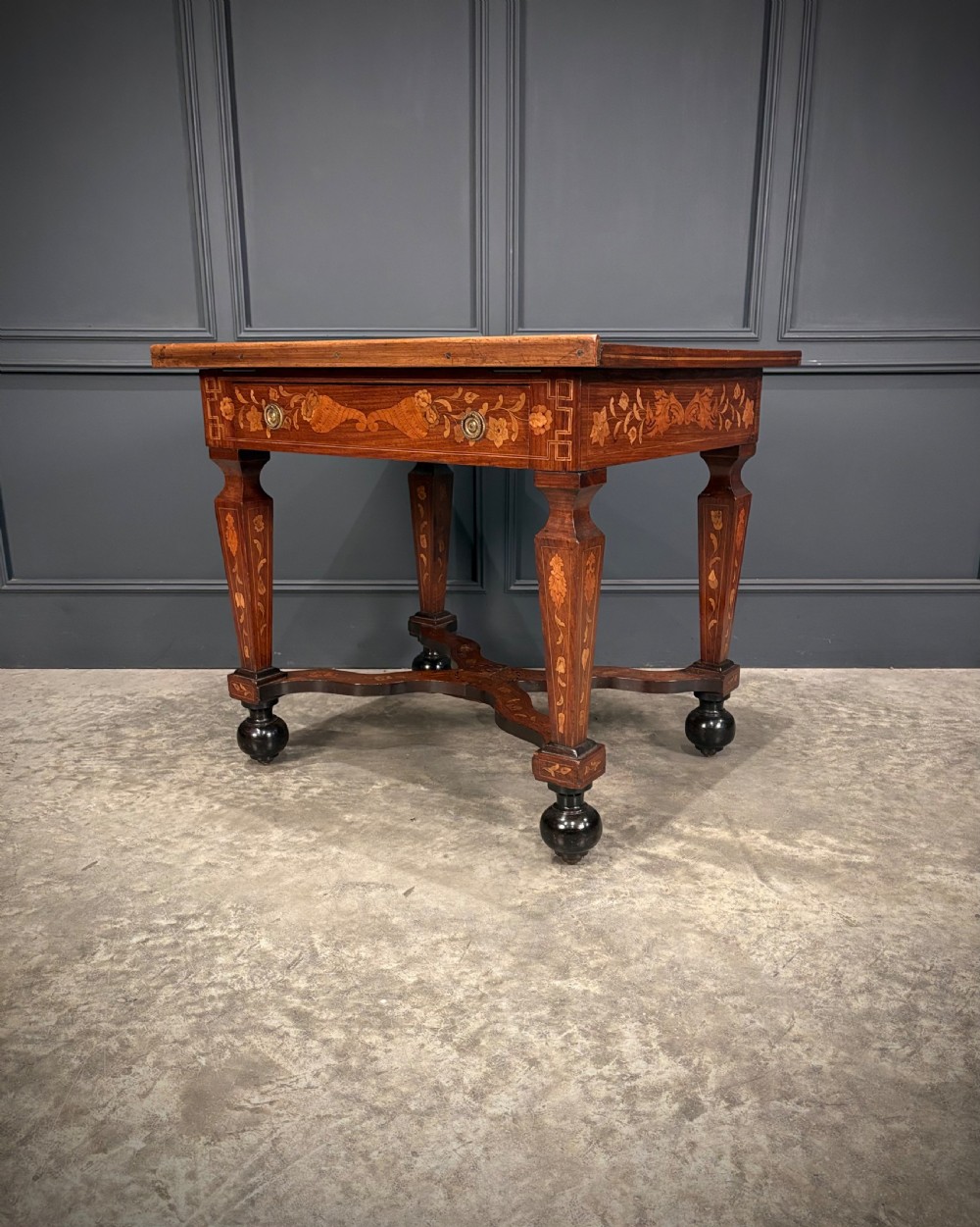 An eighteenth-century Dutch marquetry architects table featuring an adjustable tilted top decorated with floral wood inlays and resting on shaped legs with bun feet. View VIII