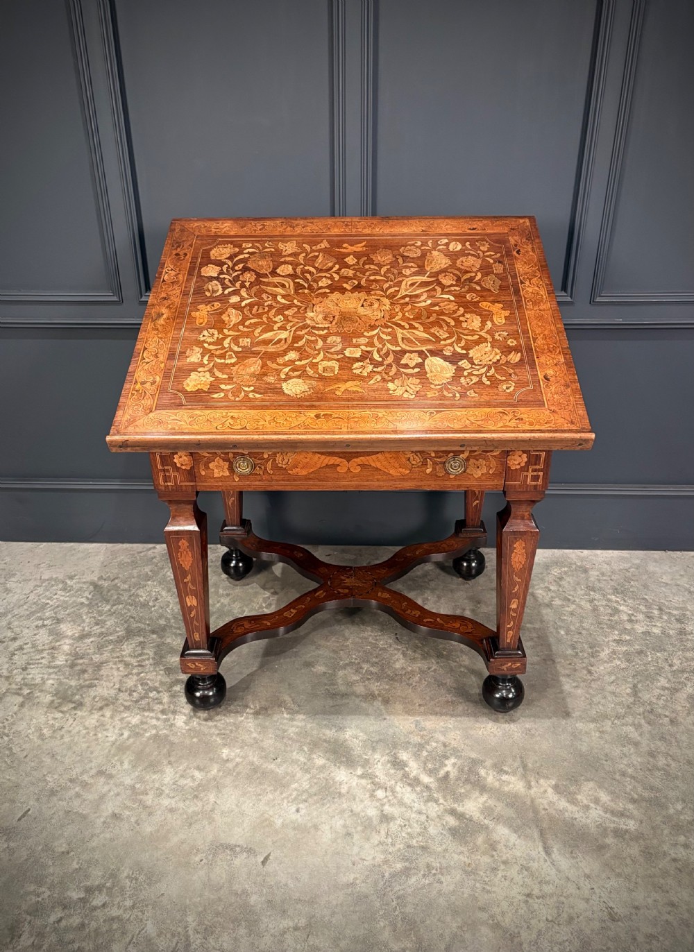 An eighteenth-century Dutch marquetry architects table featuring an adjustable tilted top decorated with floral wood inlays and resting on shaped legs with bun feet. View XII