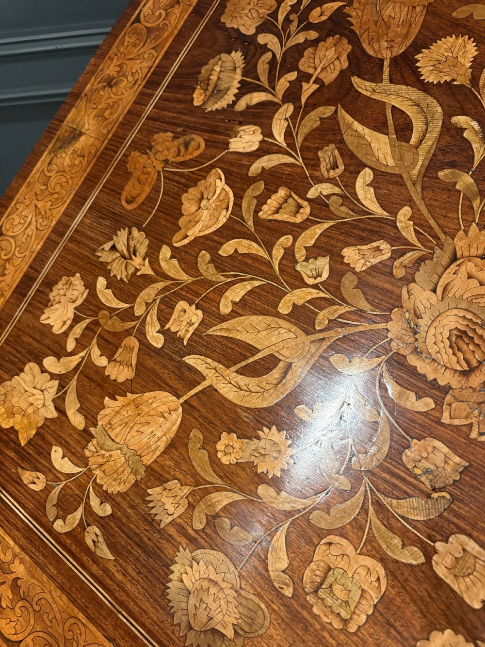 An eighteenth-century Dutch marquetry architects table featuring an adjustable tilted top decorated with floral wood inlays and resting on shaped legs with bun feet. View XIV