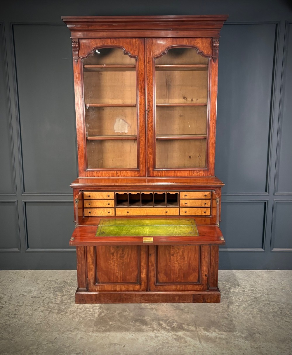 A tall Victorian mahogany secretaire bookcase featuring an upper two-door glazed cabinet over a writing drawer and lower cupboard base. View III