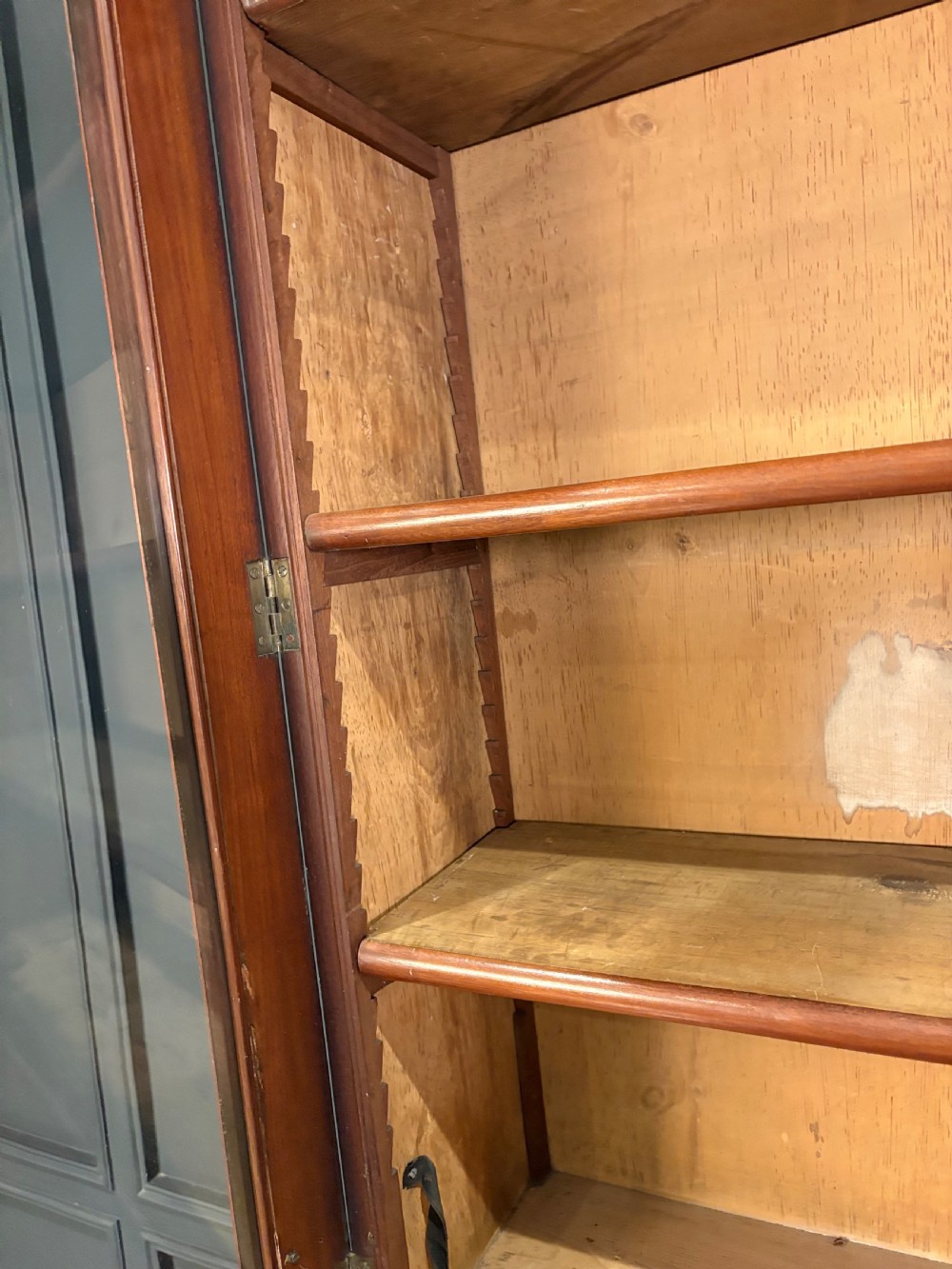 A tall Victorian mahogany secretaire bookcase featuring an upper two-door glazed cabinet over a writing drawer and lower cupboard base. View V