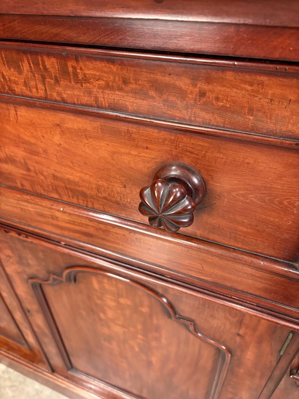 A tall Victorian mahogany secretaire bookcase featuring an upper two-door glazed cabinet over a writing drawer and lower cupboard base. View VI