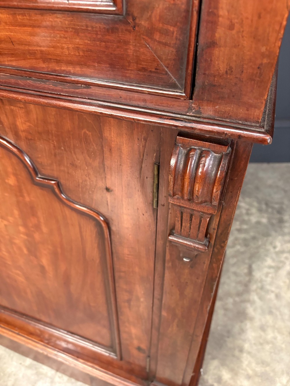 A tall Victorian mahogany secretaire bookcase featuring an upper two-door glazed cabinet over a writing drawer and lower cupboard base. View VII