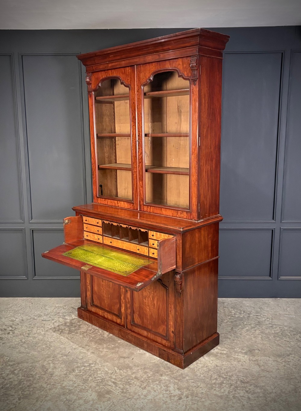 A tall Victorian mahogany secretaire bookcase featuring an upper two-door glazed cabinet over a writing drawer and lower cupboard base. View XI