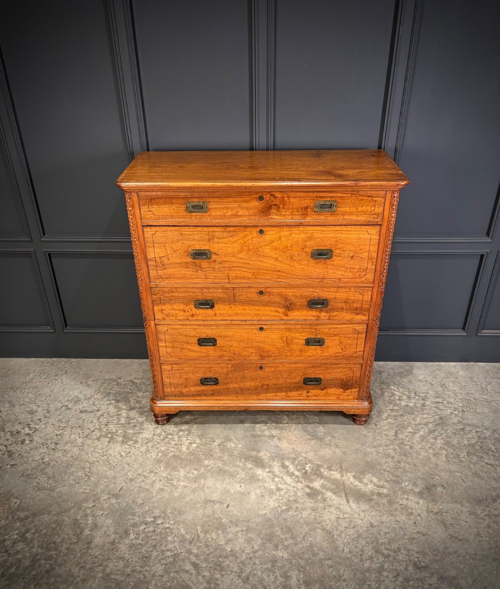 A 19th-century camphor wood campaign secretaire chest featuring a two-part split construction with flush brass handles, side carrying handles, and carved pilasters. View IV