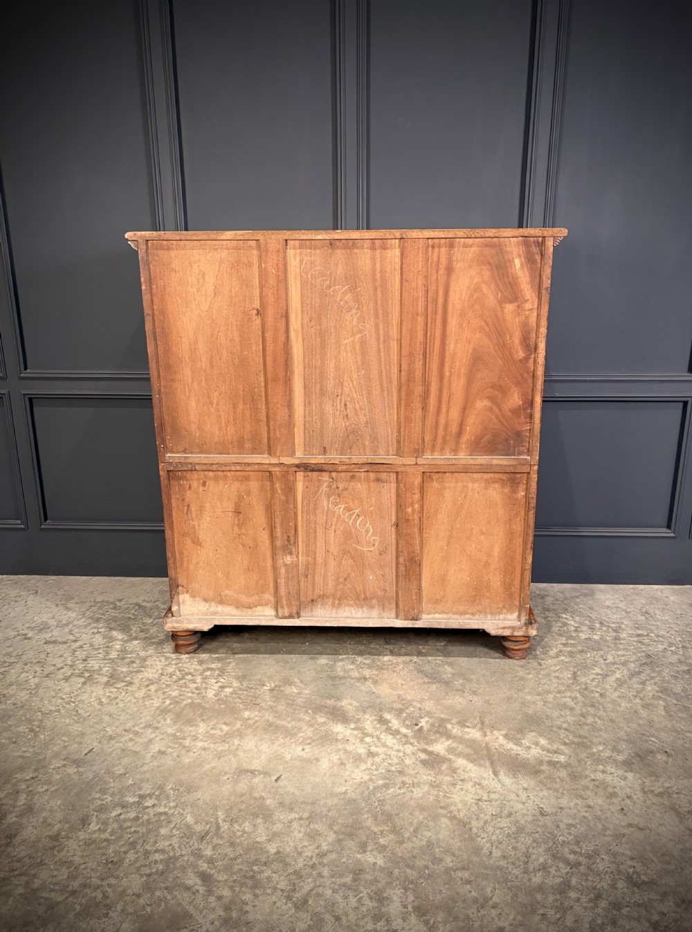 A 19th-century camphor wood campaign secretaire chest featuring a two-part split construction with flush brass handles, side carrying handles, and carved pilasters. View VII