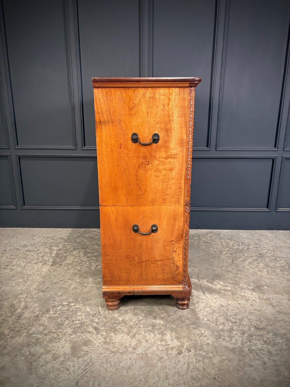 A 19th-century camphor wood campaign secretaire chest featuring a two-part split construction with flush brass handles, side carrying handles, and carved pilasters. View VIII