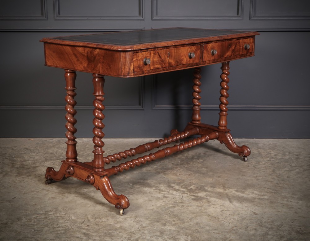 Victorian walnut library writing table with a black leather insert, barley twist legs, double spiral stretcher, and frieze drawers. View II