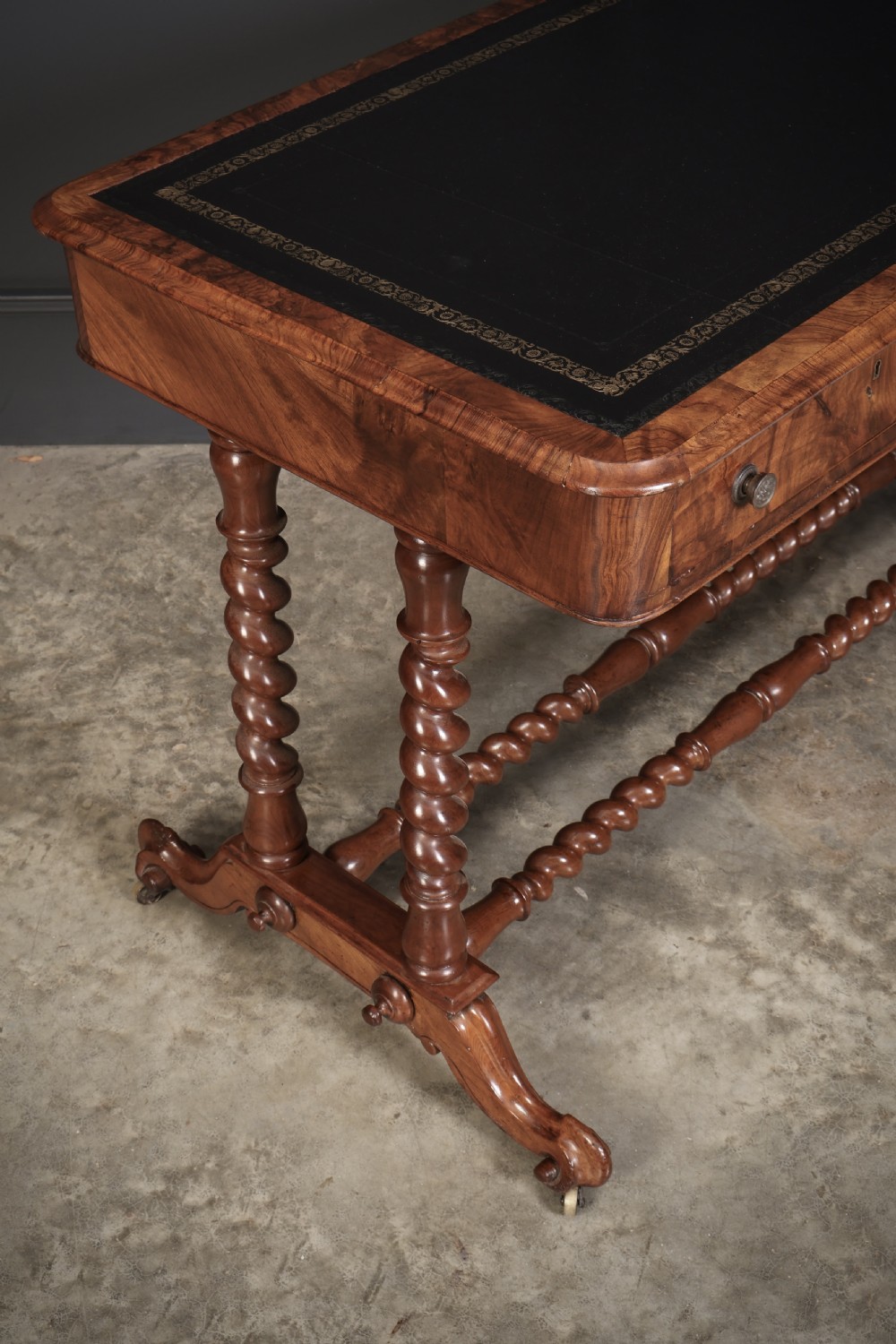 Victorian walnut library writing table with a black leather insert, barley twist legs, double spiral stretcher, and frieze drawers. View III