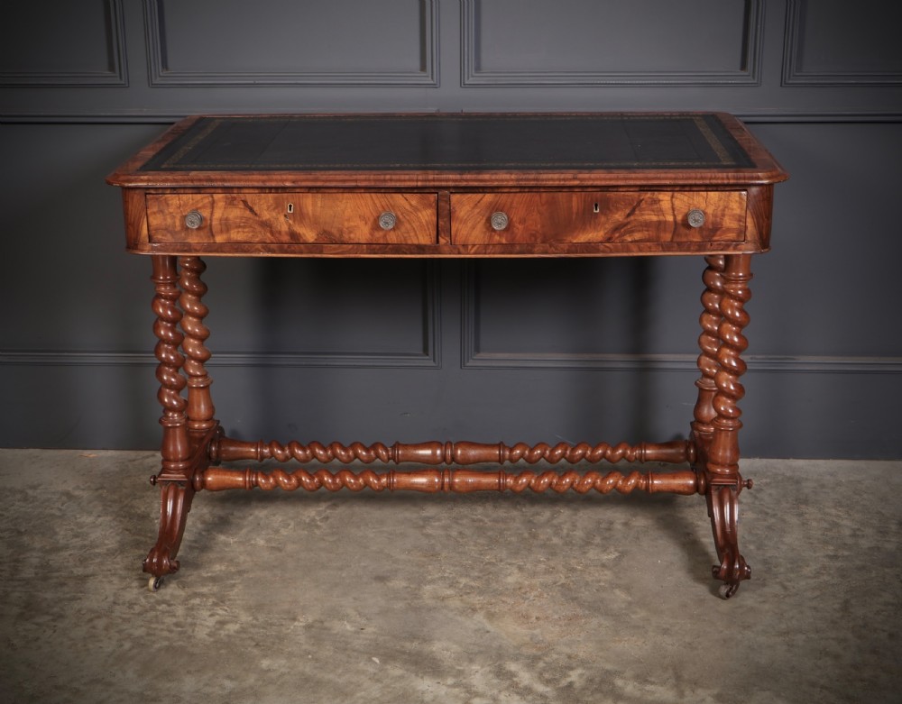 Victorian walnut library writing table with a black leather insert, barley twist legs, double spiral stretcher, and frieze drawers. View V