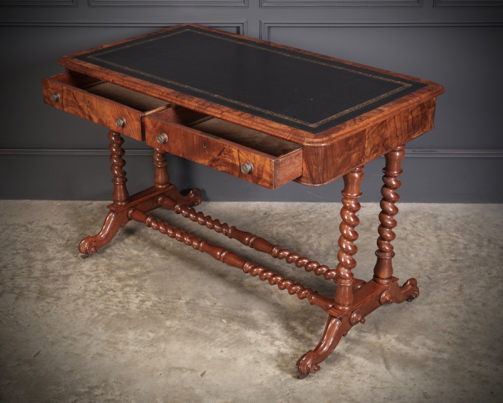 Victorian walnut library writing table with a black leather insert, barley twist legs, double spiral stretcher, and frieze drawers. View VIII
