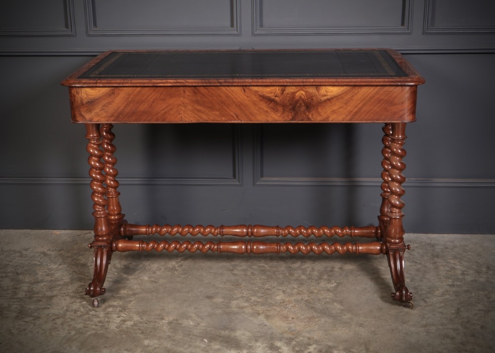 Victorian walnut library writing table with a black leather insert, barley twist legs, double spiral stretcher, and frieze drawers. View XII