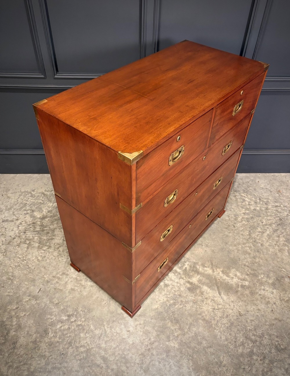 A Victorian two-part mahogany military campaign chest featuring two short over three long drawers with flush brass handles and brass corner straps. View III